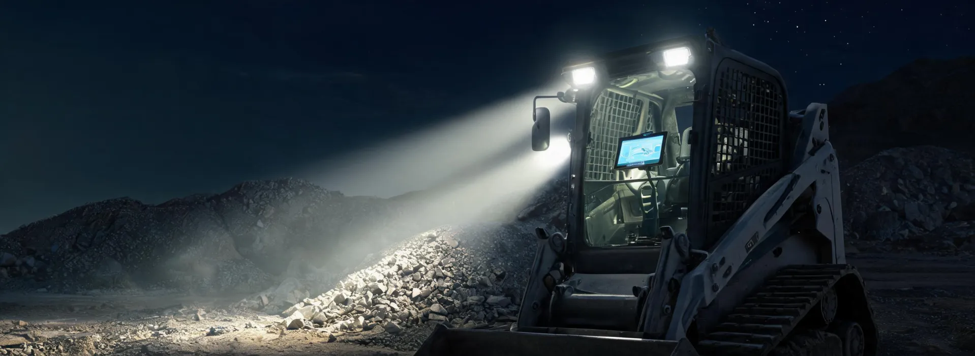 Night quarry with compact loader headlights